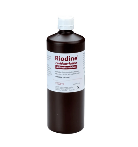 Bottle of Riodine Povidone-Iodine Antiseptic Solution on a white background